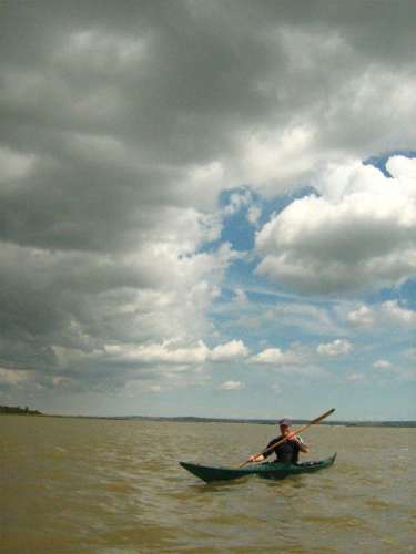 Sea kayak under stormy sky