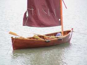 Small open sail-oar boat