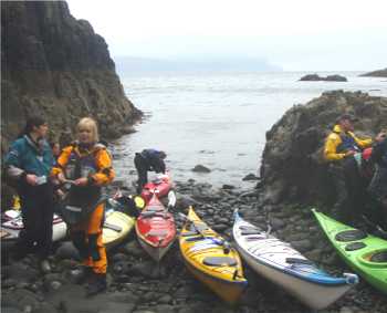 Sea kayakers in drysuits