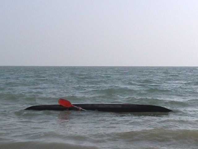 One of sequence of kayak rolling photos