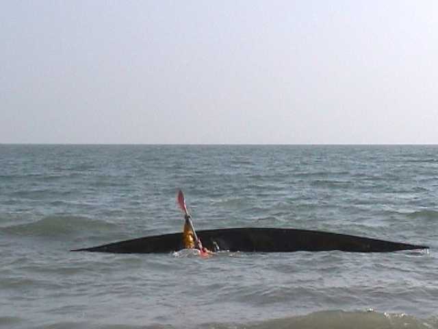 One of sequence of kayak rolling photos