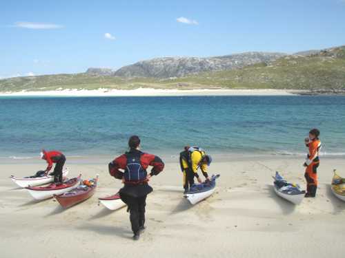 Kayakers on beach in NW Scotland